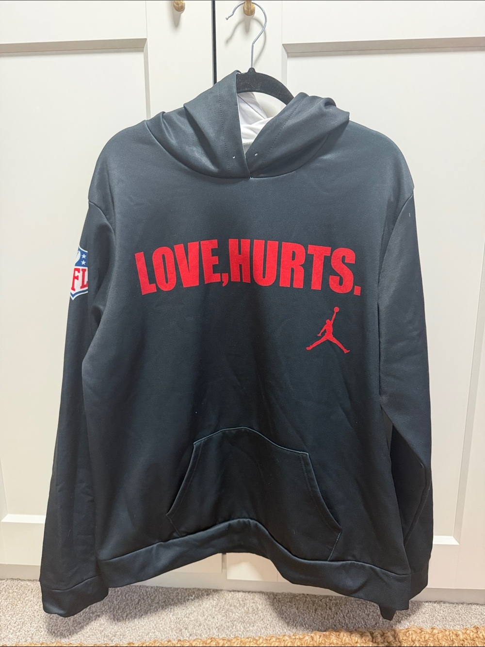 Eagles Black Hoodie with Red "LOVE, HURTS." Script
